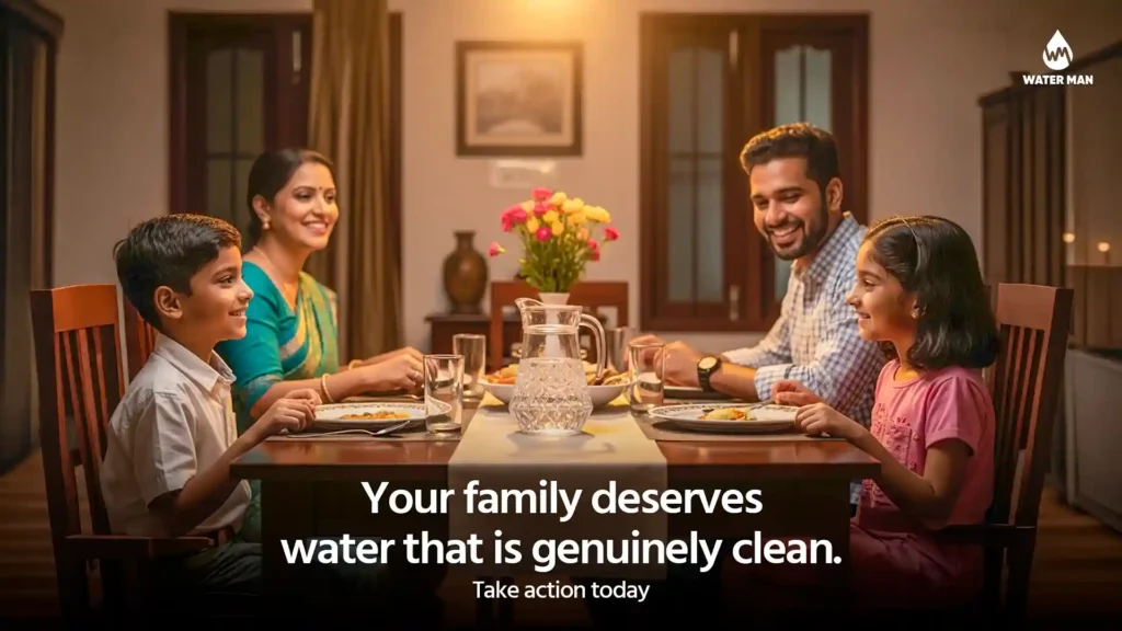 Happy Bangladeshi family sitting at dinner table with clear drinking water showing solution to iron in water Bangladesh